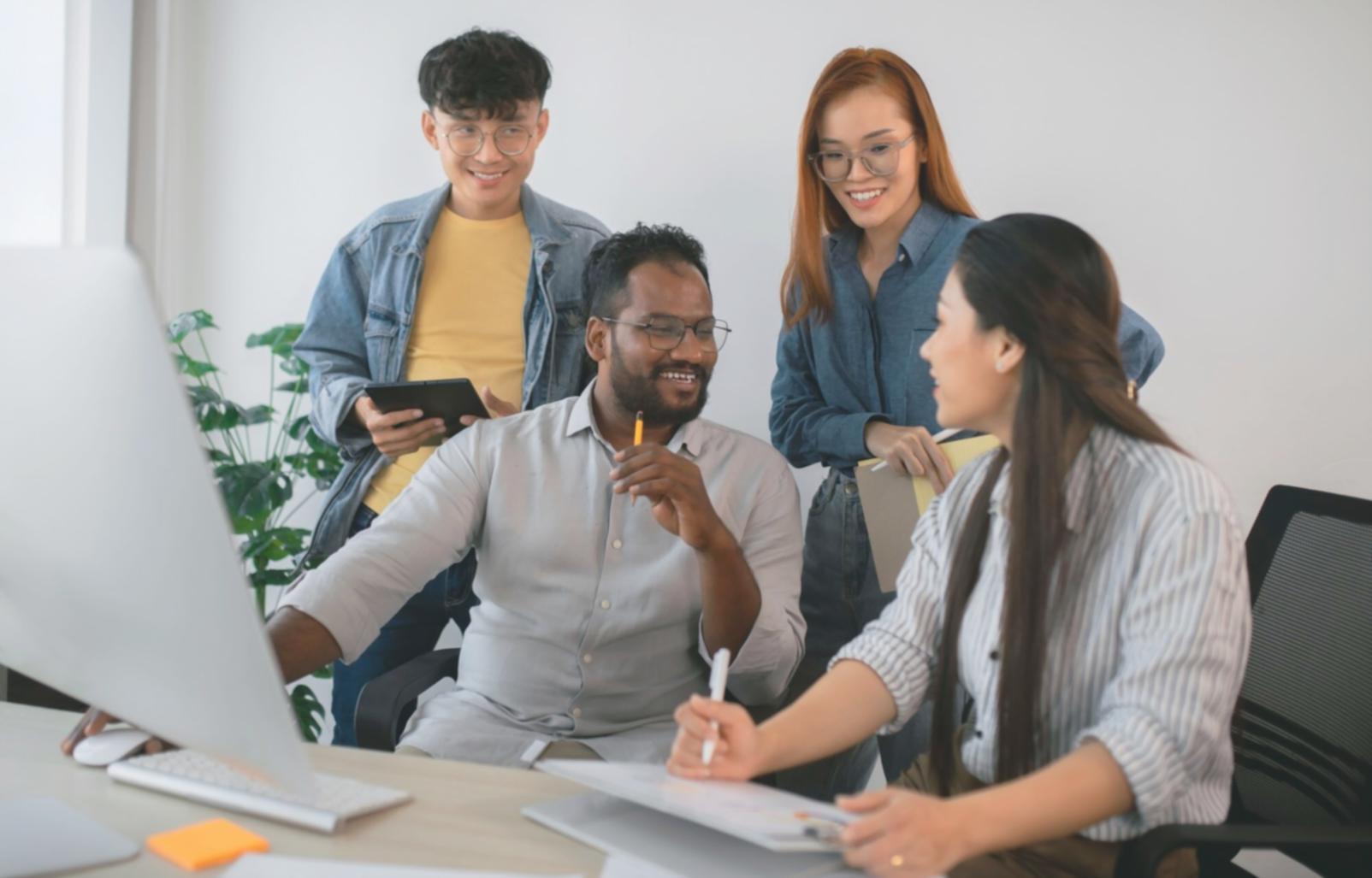 Business professional reviewing automated financial reports on laptop